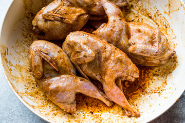 Raw Quail Meat with Sauce Ready to Cook in Bowl.
