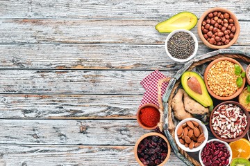 Various superfoods. In a wooden box. Top view. Free copy space.
