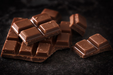 chocolate on a dark slate plate, macro shot, selected focus