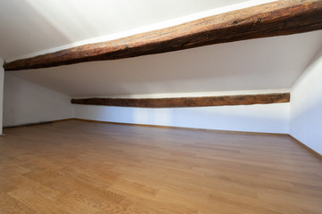 Attic with wooden beams and parquet