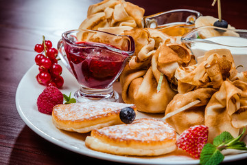 sweet pancakes with fruits and berries