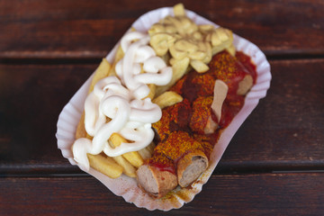 A typical german fast food menu: currywurst and french fries