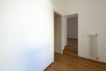 Corridor with open doors and parquet steps