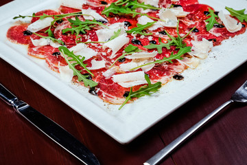 meat carpaccio with arugula