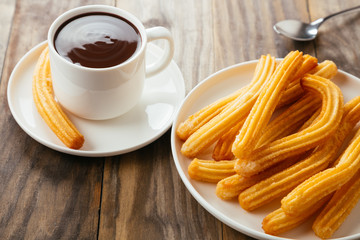 Delicious spanish breakfast with churros and chocolate