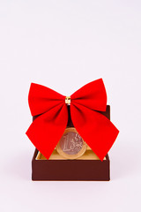 One euro for gift with red ribbon