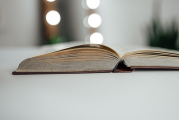 open book on wooden table