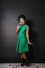 Full length portrait of a cheerful afro american woman