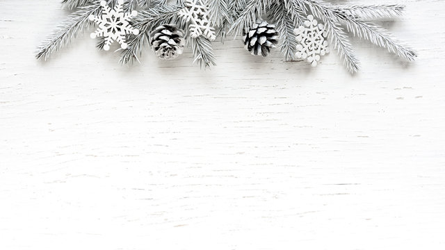 Christmas White Fir Tree Branches With White Decorations.