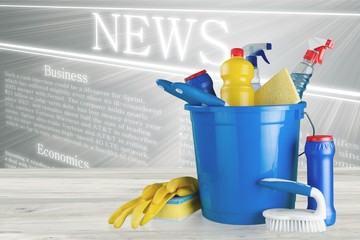 Plastic bottles, cleaning sponges and gloves on blue background