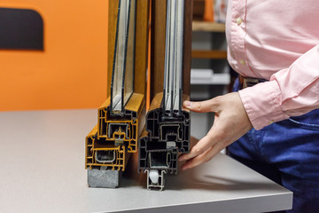 A man shows insulation for the windows
