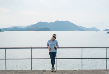 Young Asian woman travel at the beach in Hong Kong