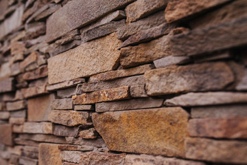 Old stone texture. Pattern brown and gray colors of style design decorative cracked stone wall surface.