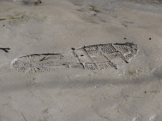 Schuhabdruck im Sand