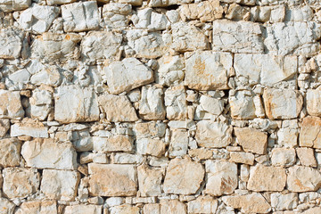 Old bricks brown wall background. Stones pattern. Castle outdoor wall. 