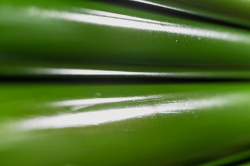 Rolling shafts in the paint of industrial printing machine. Offset printing.