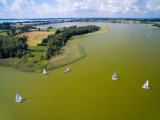 Aerial view of yachts sailing on Swiecajty Lake, Mazury, Poland - obrazy, fototapety, plakaty