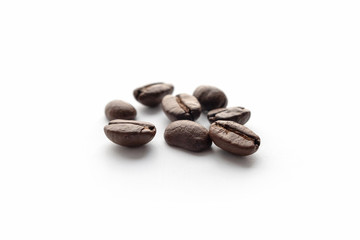 Roasted coffee beans isolated on white background.