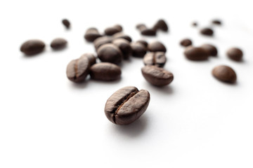Roasted coffee beans isolated on white background.