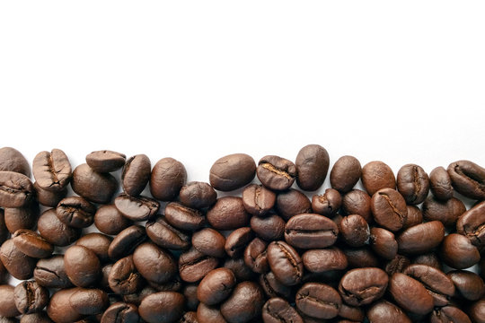 Roasted coffee beans for background.