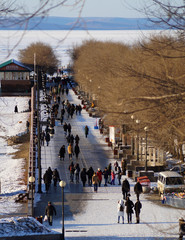 People walk along the embankment of Vladivostok, Russia
