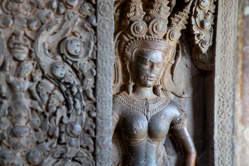 Sculpture of Apsara by Stone carving of angels on the wall of Angkor Wat in Siem Reap, Cambodia