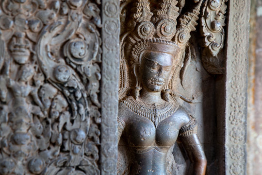 Sculpture of Apsara by Stone carving of angels on the wall of Angkor Wat in Siem Reap, Cambodia