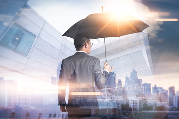 The double exposure image of the Businessmen are spreading umbrella during sunrise overlay with...