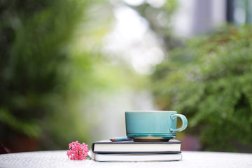 vintage blue cup and notebook at outdoor