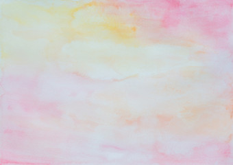 Fototapeta premium Abstract light watercolor background in pink, yellow and orange with watercolour stains and paper texture.