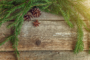 Christmas New Year composition with fir branch pine cones balls on old shabby rustic wooden background. Xmas holiday december decoration to Russian tradition. Flat lay top view copy space