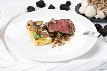 True scented Beef Tenderloin, local true, gratin potatoes, sauteed wild mushrooms, cheese sauce
