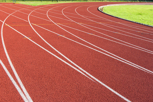 Crossroad on the red track of athletics