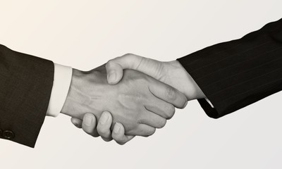 Business agreement handshake on white background. Black and