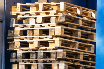 wooden pallets stacked in a factory, close-up, woodworking, wood products