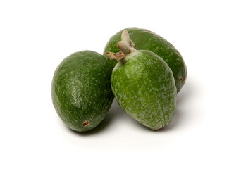 Green feijoa fruits on white background.