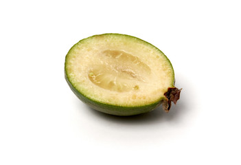 Green feijoa fruits on white background.