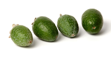 Green feijoa fruits on white background.