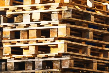 wooden pallets stacked in a factory, close-up, woodworking, wood products
