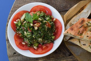 Traditional Lebanese Tabbouleh salad with tomatoes, parsley, lemon, mint