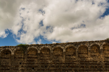 Massa Marittima , Italy - landscape walls of the Sienese fortress with cloud