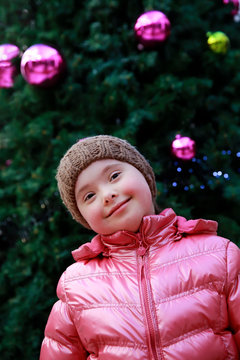 Portrait of young girl on background of the christmas tree