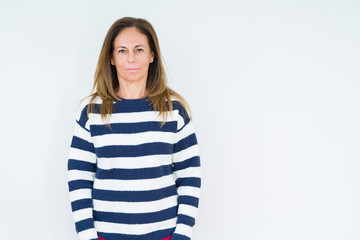 Beautiful middle age woman wearing navy sweater over isolated background Relaxed with serious expression on face. Simple and natural looking at the camera.