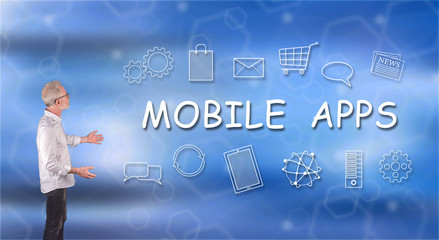 A mobile apps concept explained by a businessman on a wall screen