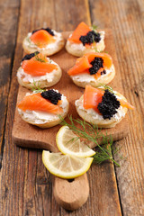 bread with cheese, salmon and caviar