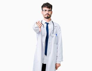 Fototapeta premium Young doctor man wearing hospital coat over isolated background looking unhappy and angry showing rejection and negative with thumbs down gesture. Bad expression.