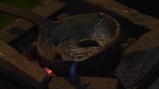 Production of antique coin during a reenactment at Breno (Italy) on August 12, 2018. 