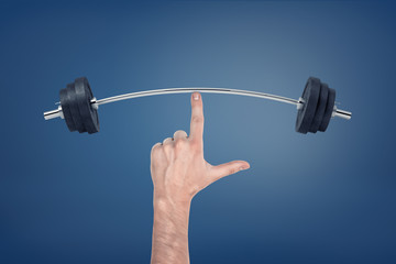 Large male hand with a pointed index finger touching a bent weightlifting barbell.