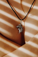 Sword snake silver pendant on woman