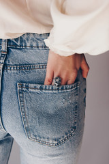Fit female butt in jeans with hand in pocket